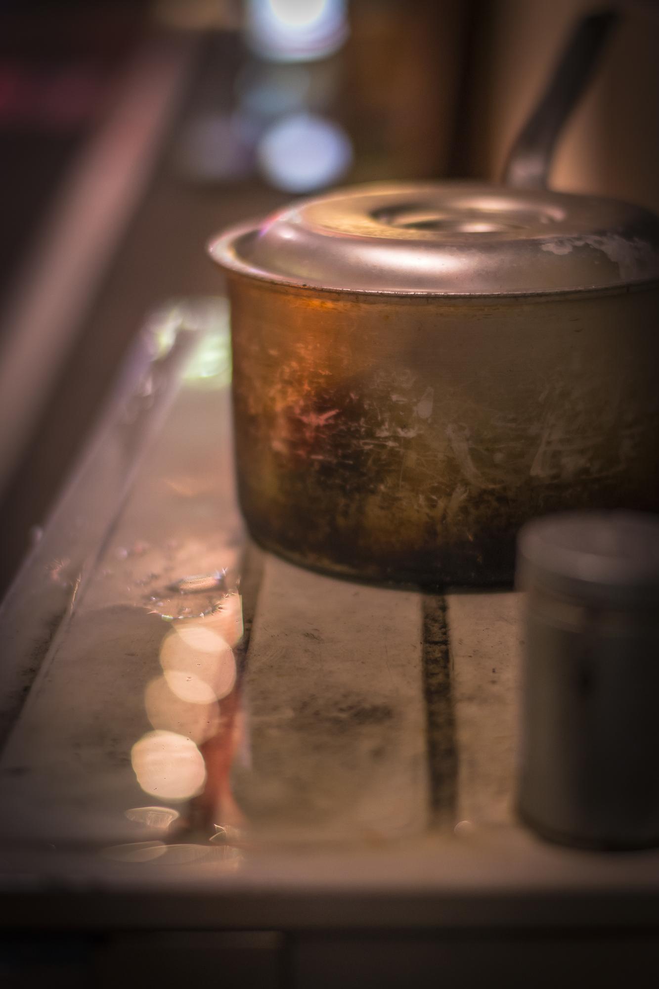close-up of a simmering pot with steam