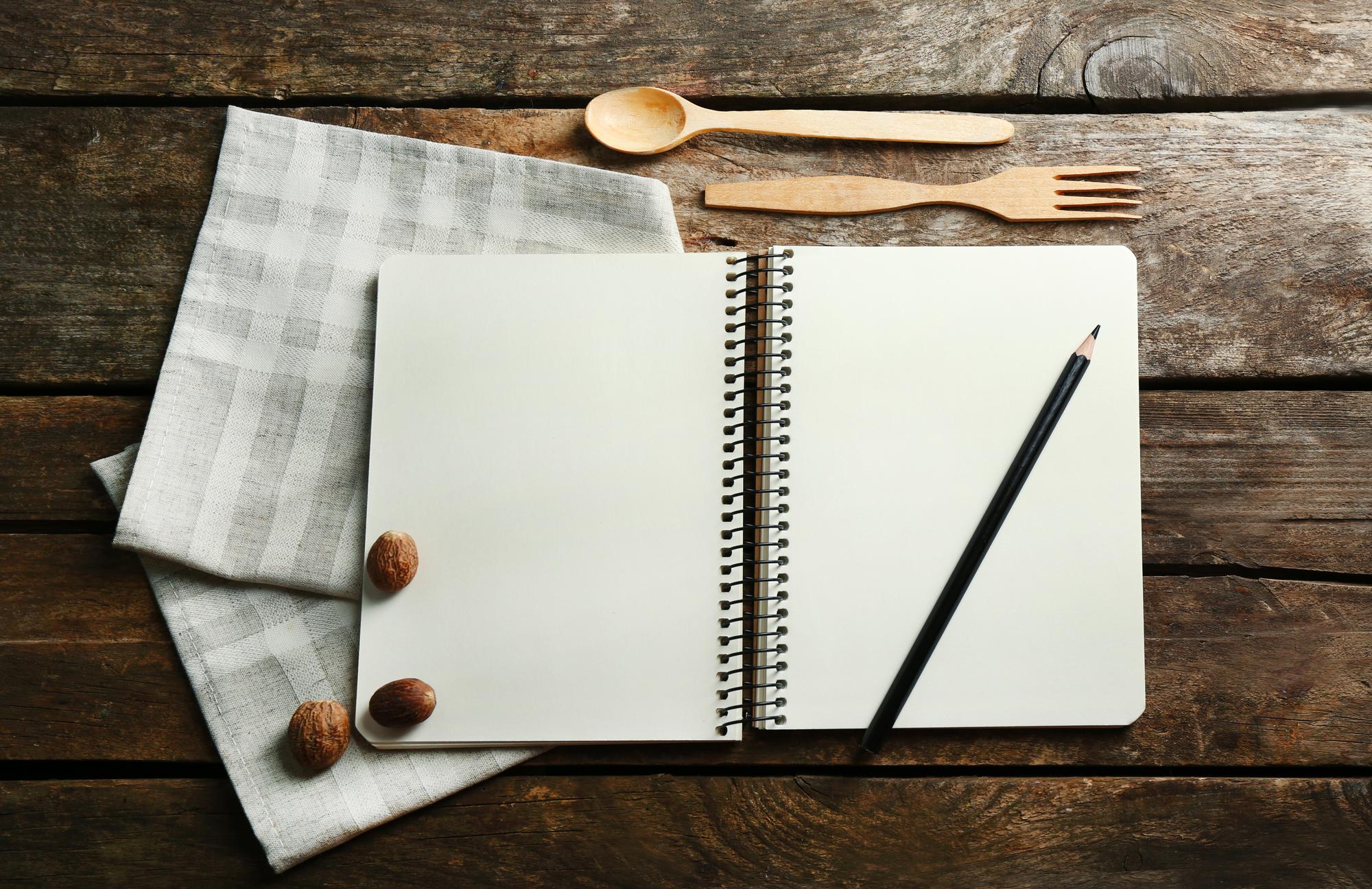 notebook with sample menu and pen